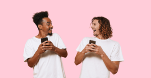 Two people on their phones laughing with each other